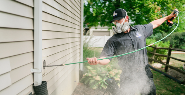 Technician cleaning dryer vent.